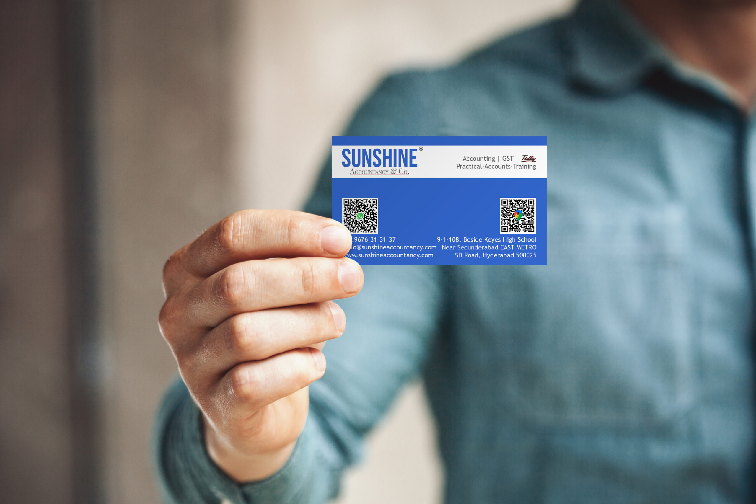 Man holding business card on blurred background